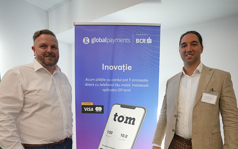 Bora Göknar and Radovan Bryx with global payments banner in event