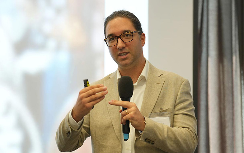 Bora Göknar speaking at global payments event